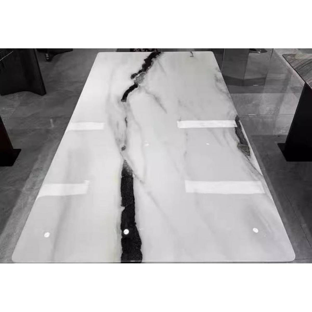 Close-up view of the Panda White marble tabletop showing natural veining