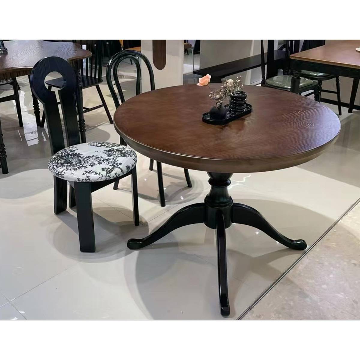 Close-up of the round dining table base and tabletop texture