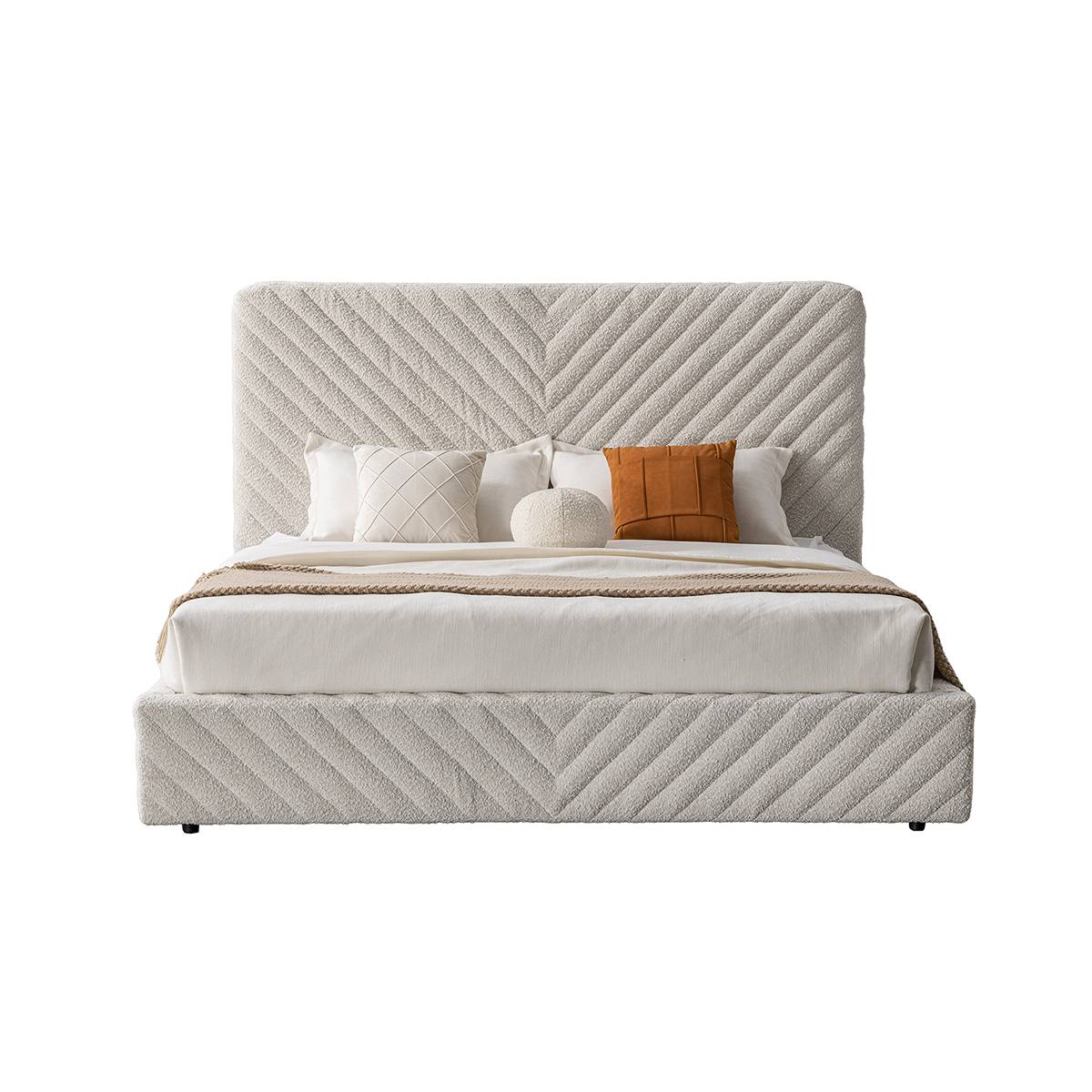 Front view of the chevron quilted fabric bed against a white background