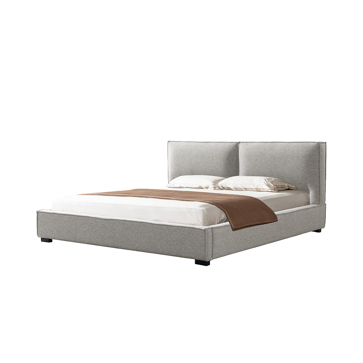 Three-quarter view of a grey fabric soft bed on a white background