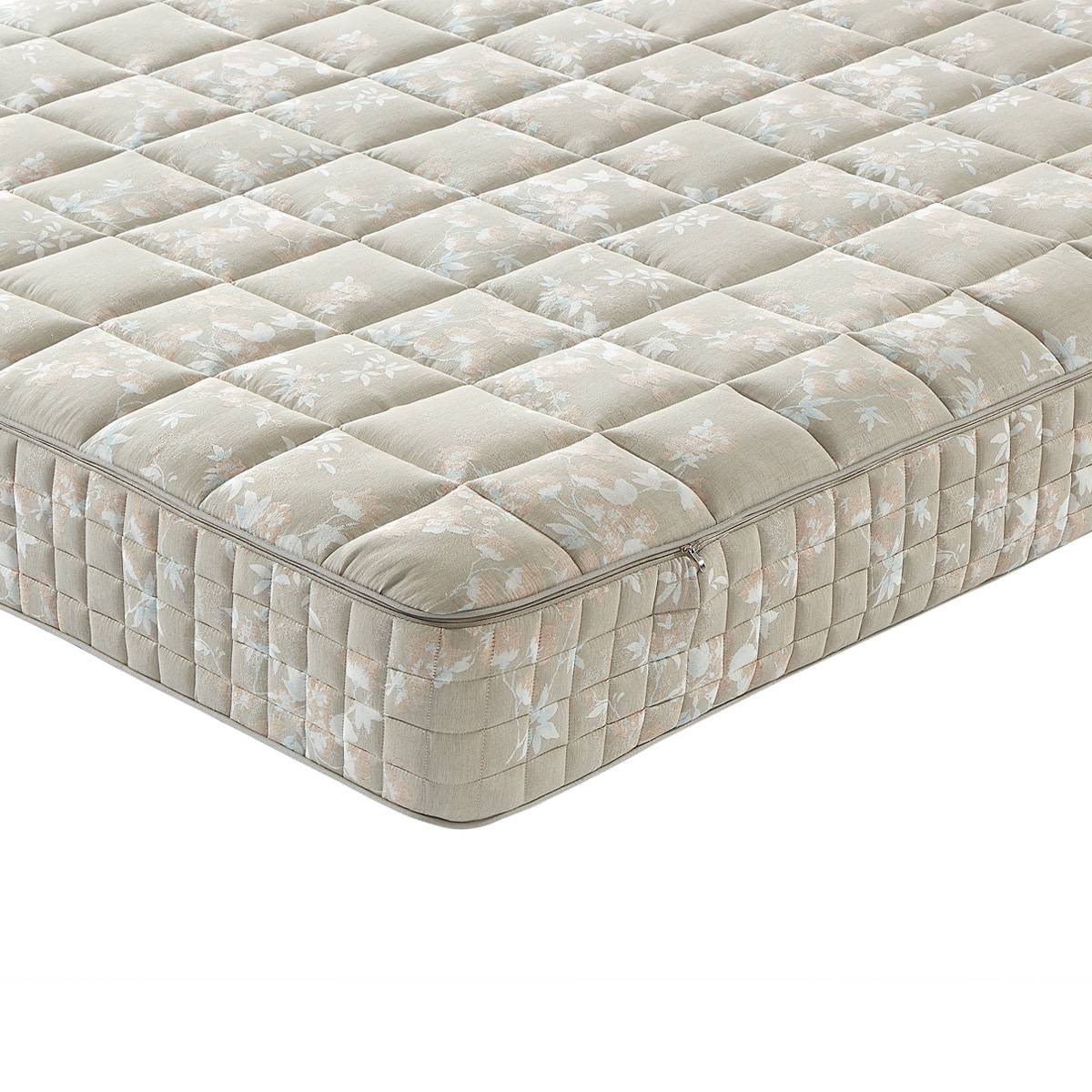 Close-up of the mattress surface showing the floral pattern and zipper