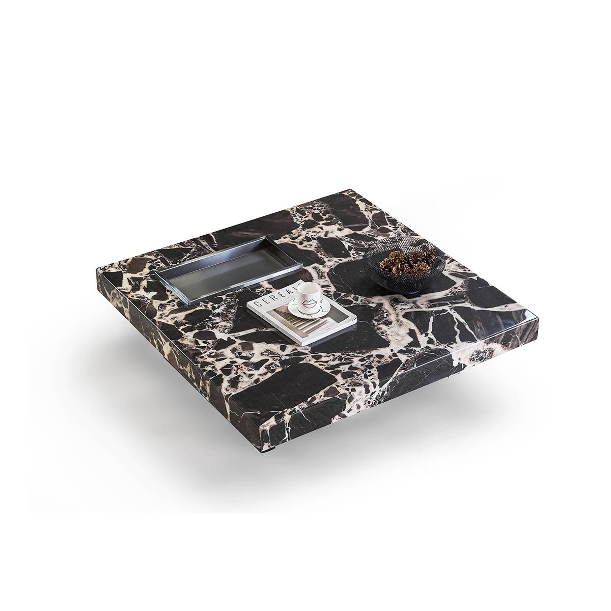 Top-down view of the marble coffee table showing the surface pattern and accessories