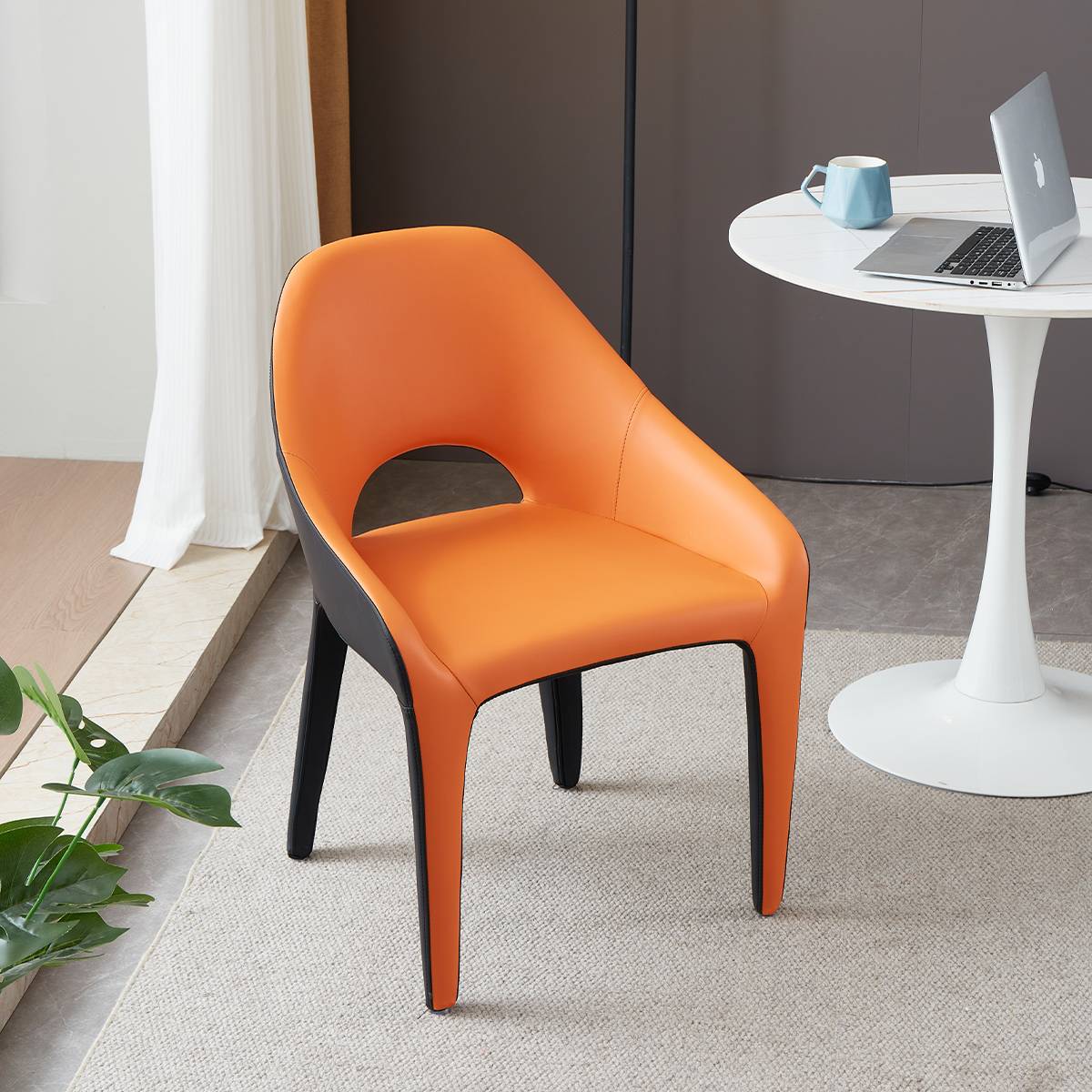 Three-quarter view of an orange and black modern lounge chair