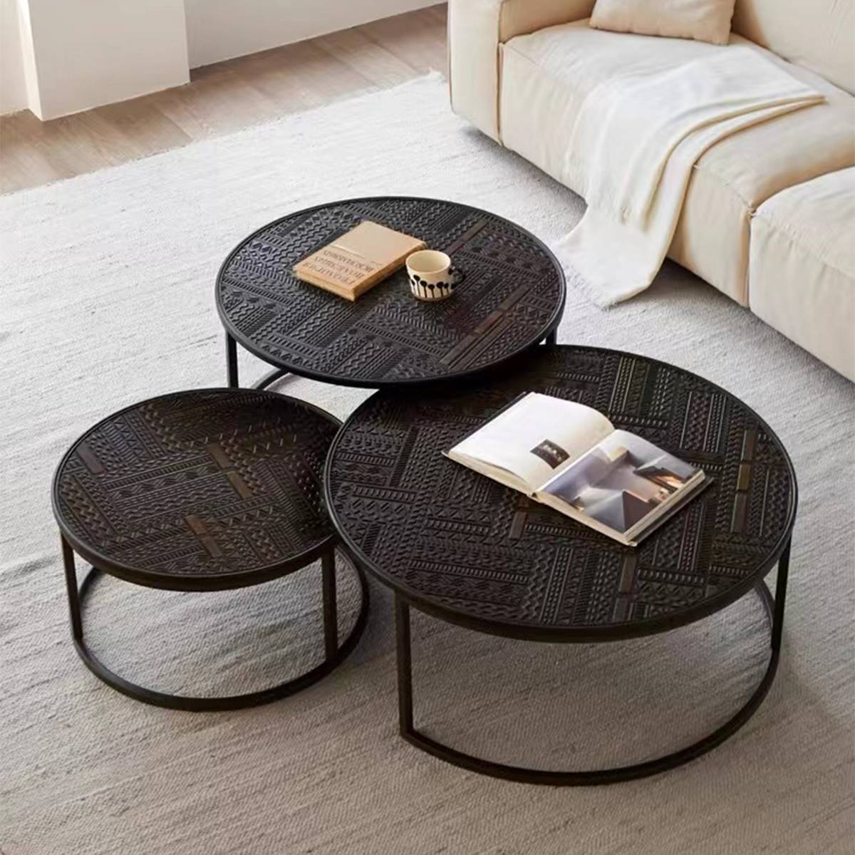Mid-century modern round coffee table with geometric pattern and black finish