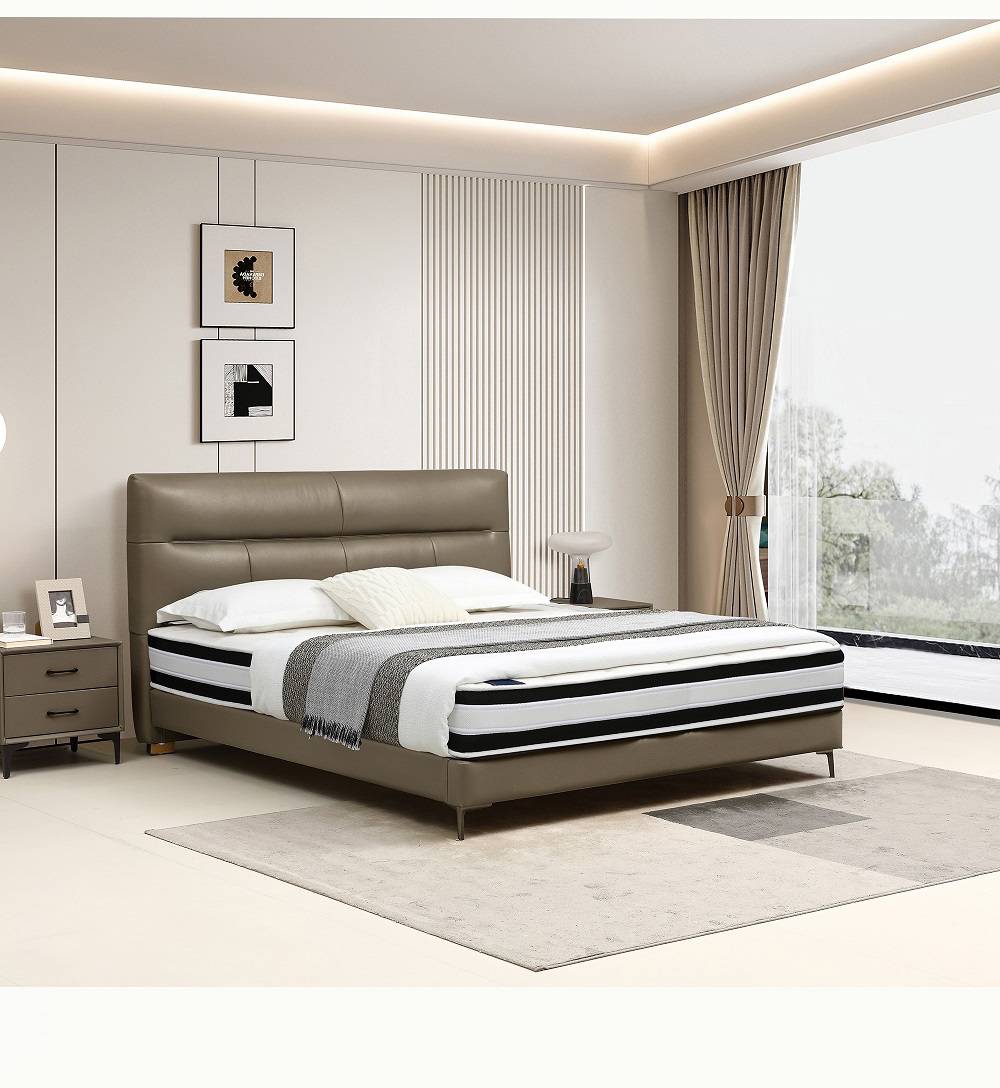Bedroom scene showing the bed with bedside table and decor