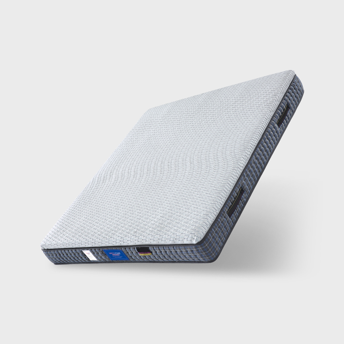 Angled view of the mattress highlighting the side profile and handles
