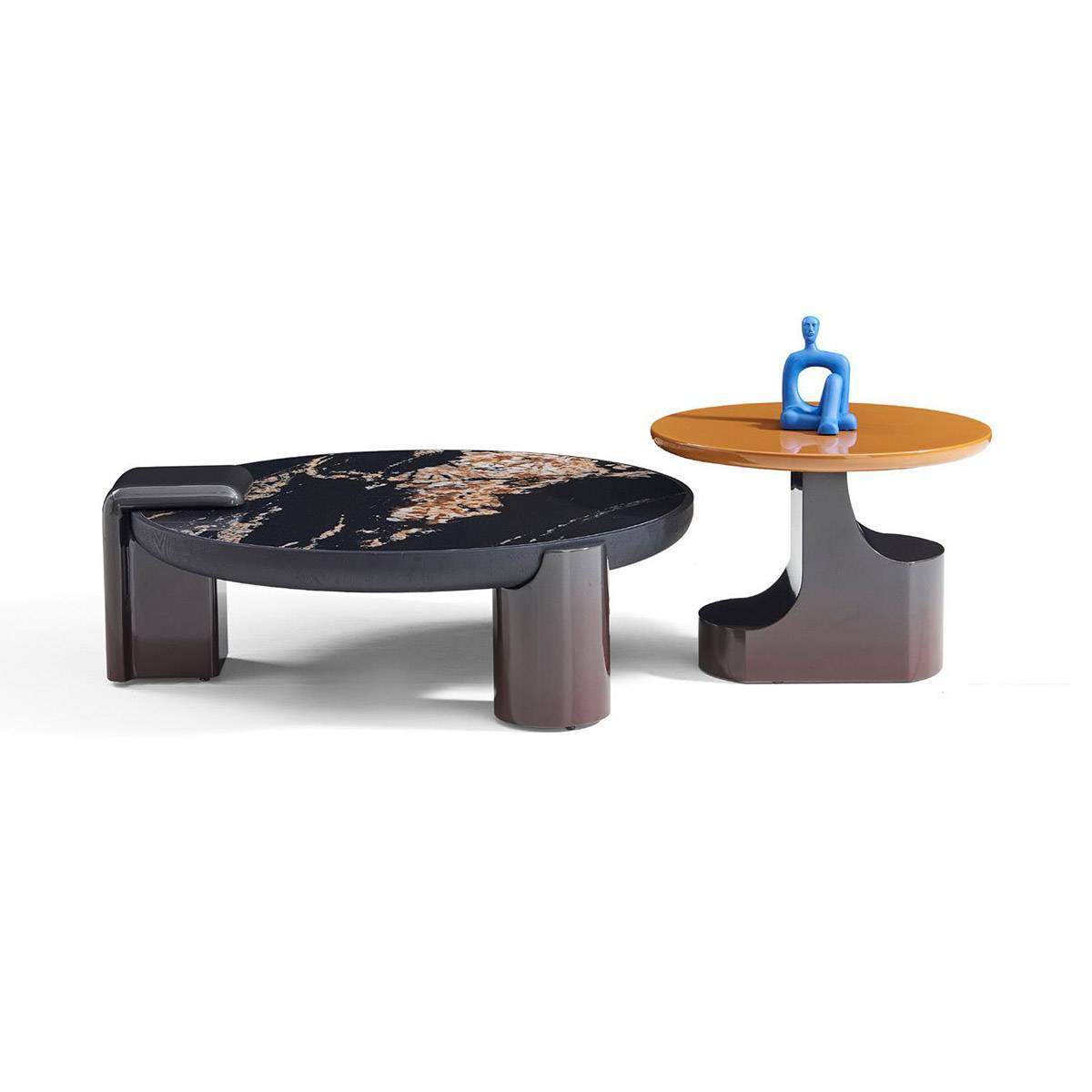 Side view of the coffee table set highlighting the sculptural base design and the blue decorative figure on the side table.