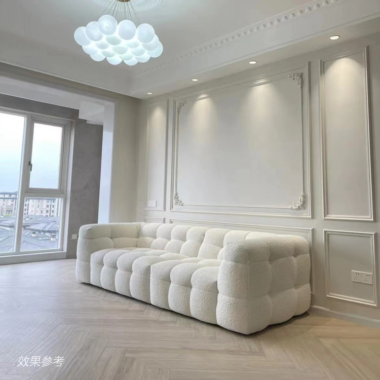 Cream colored Marshmallow Sofa in a living room with white walls