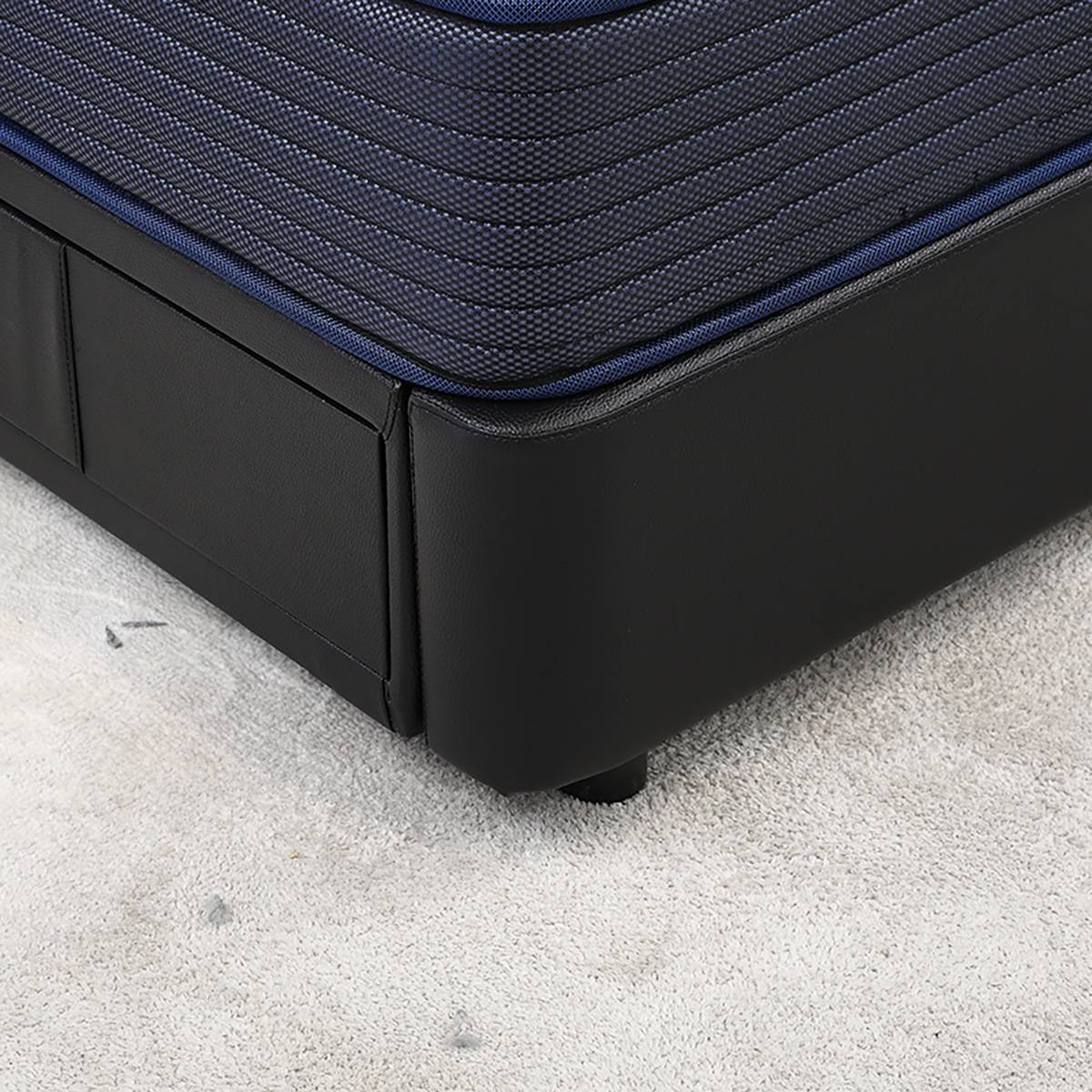 Detail shot of the bed frame corner and leather texture