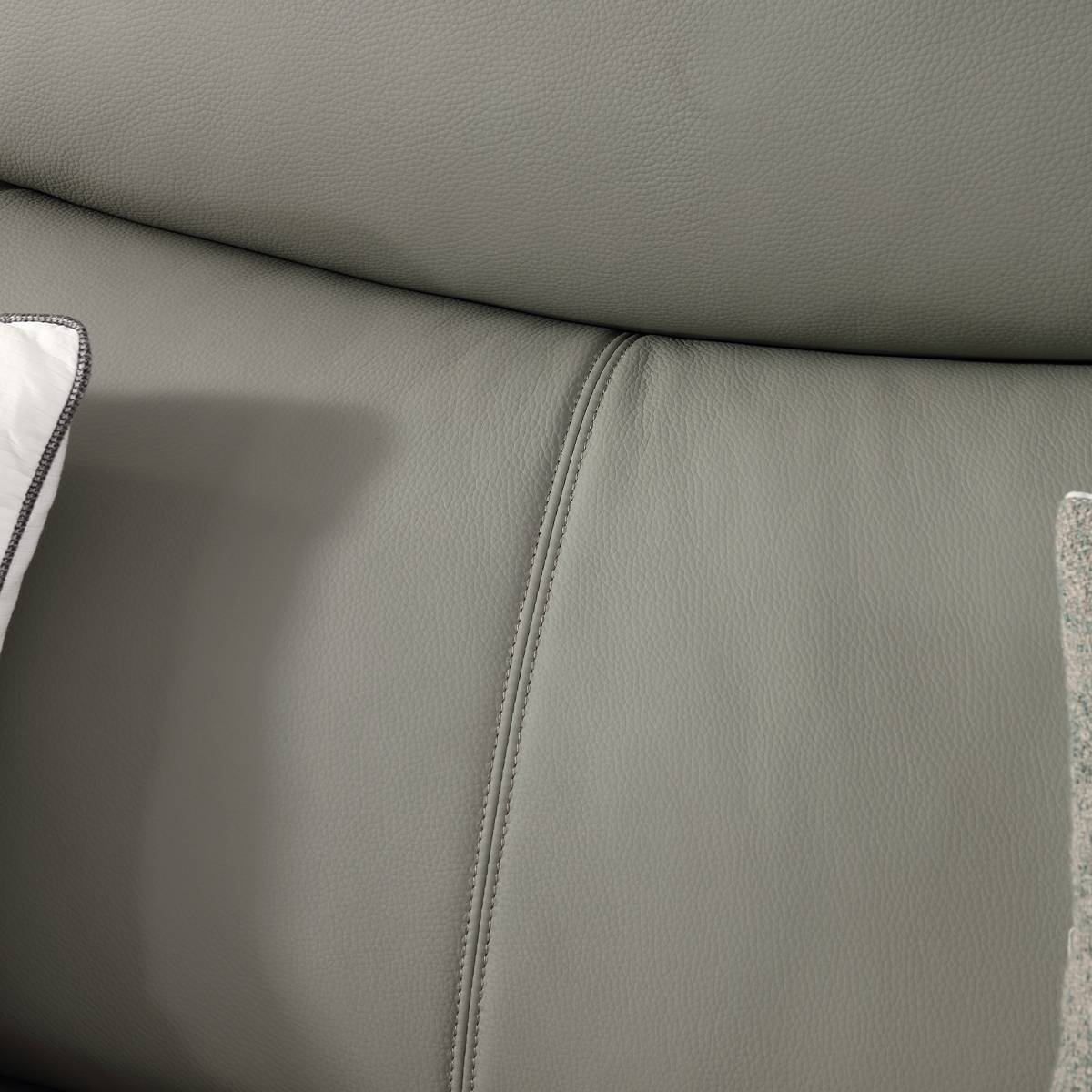 Close-up detail of the grey leather texture and stitching
