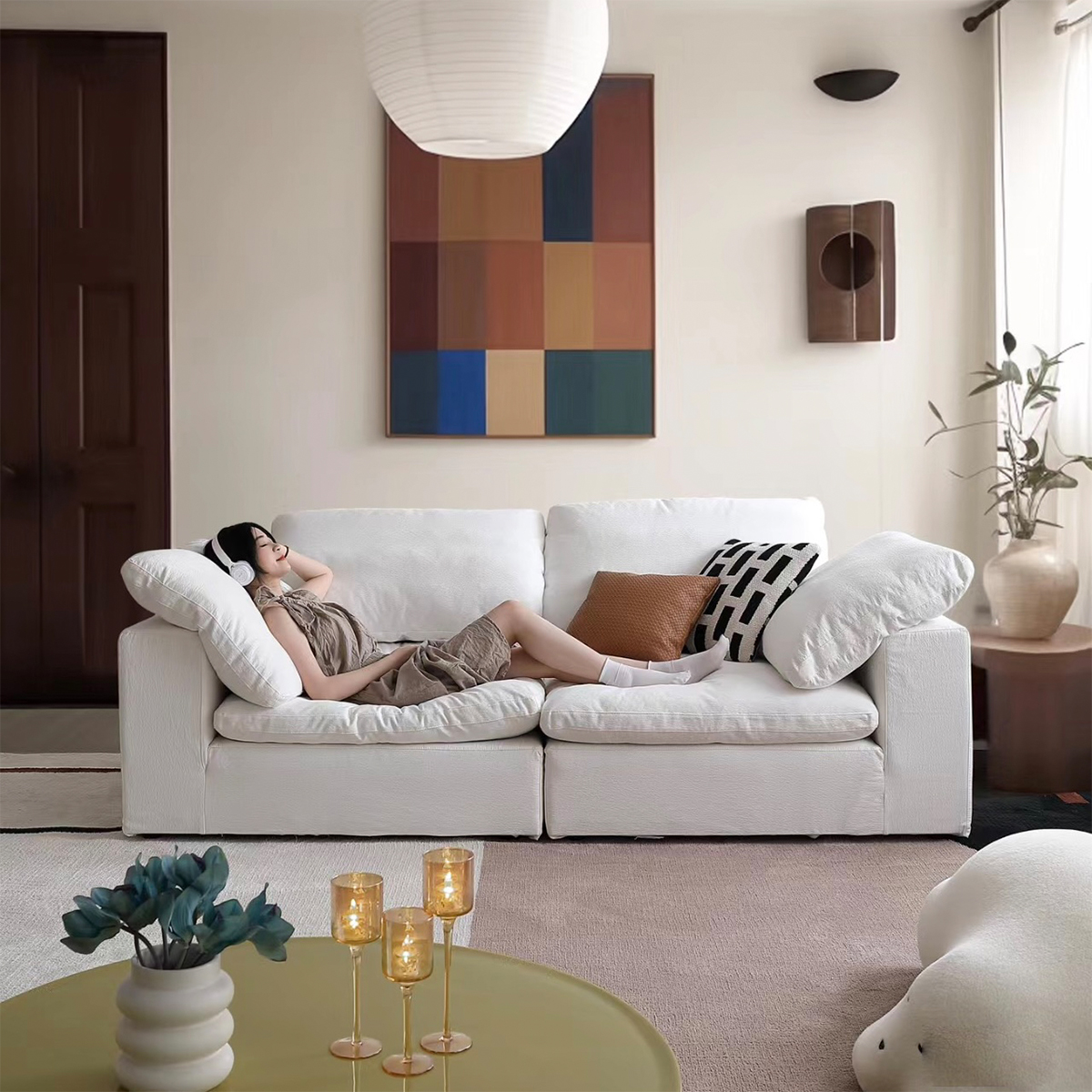 Front view of white 3-seater cloud sofa in a living room setting