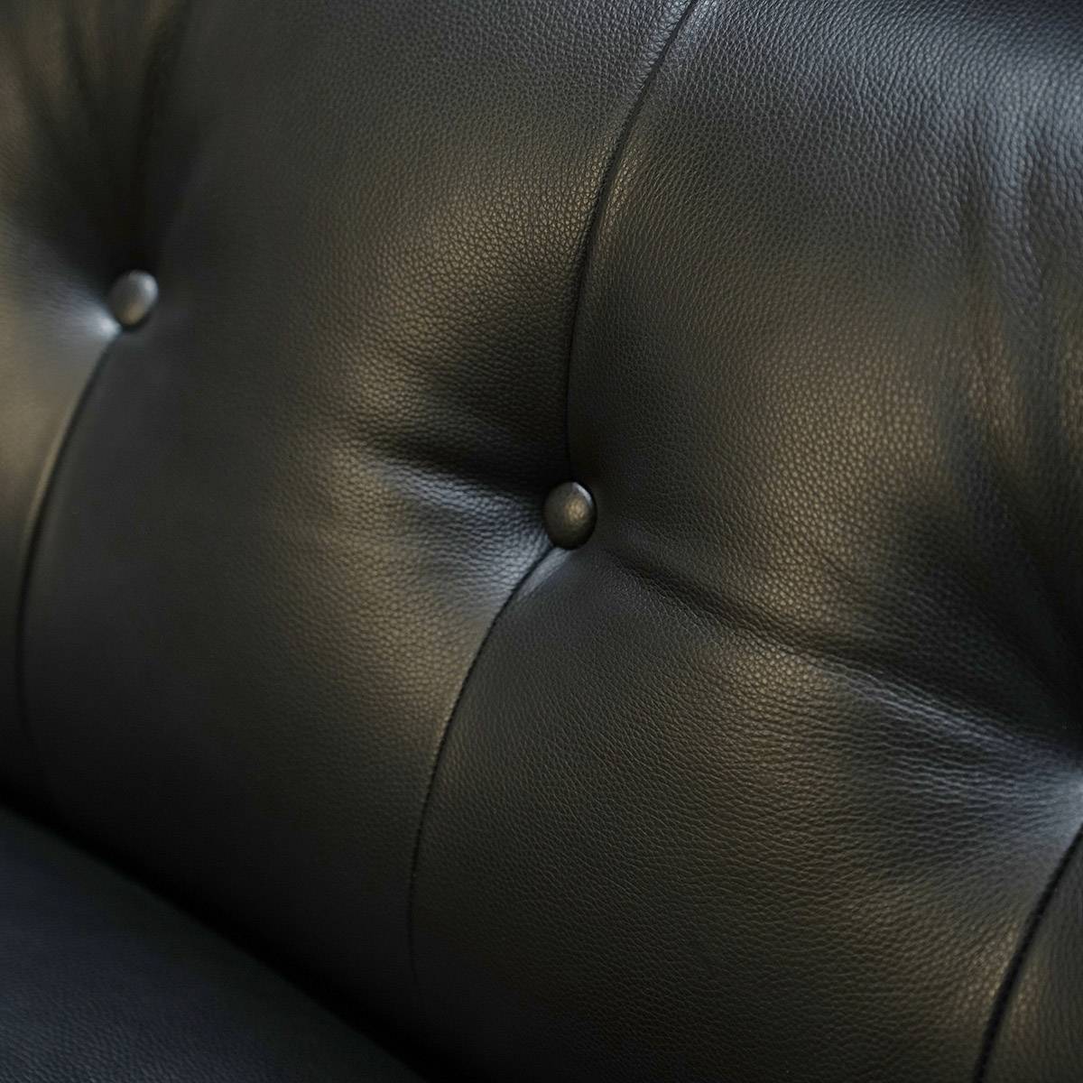 Macro shot of the leather texture and button tufting