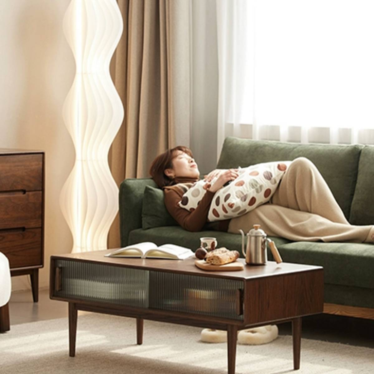 Dark wood finish Fuji coffee table placed in front of a green sofa