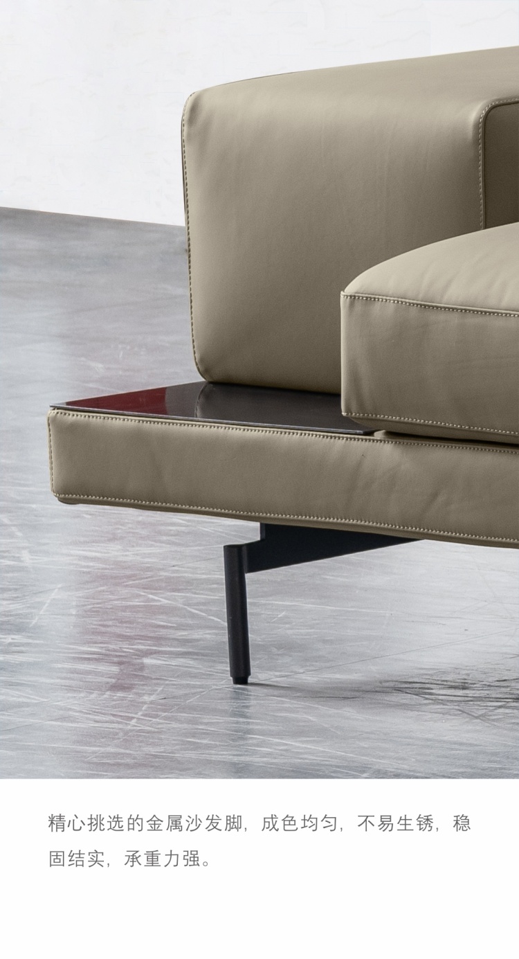 Close-up of the metal sofa leg and the base of the sofa.