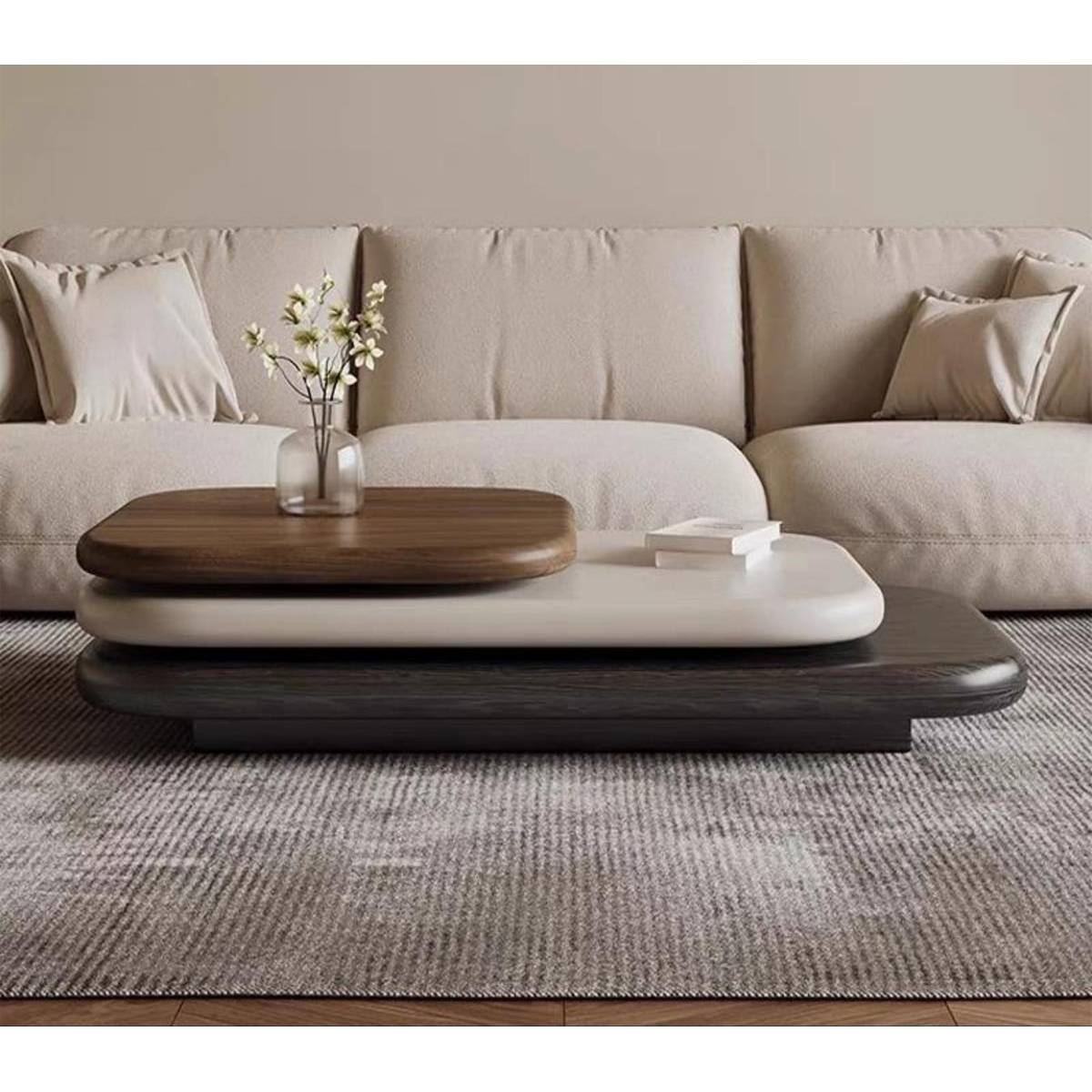 Front view of the layered coffee table showing the rotating top and stacked design