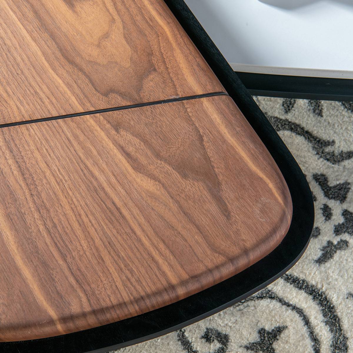 Close-up of the walnut wood veneer surface of the coffee table