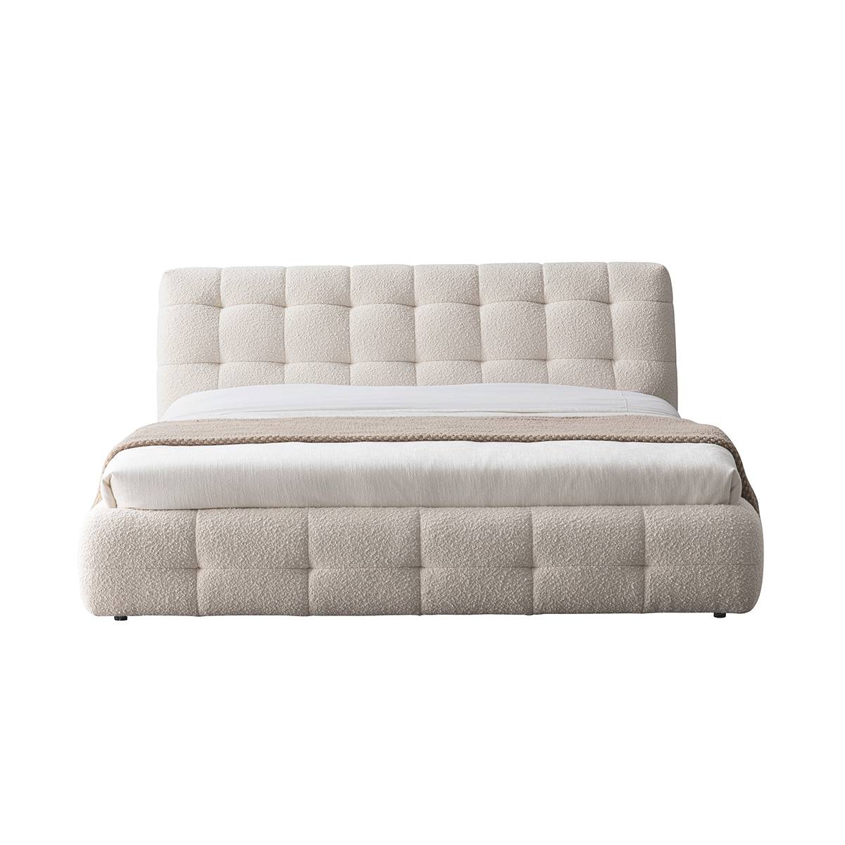 Front view of the tufted bed frame against a white background