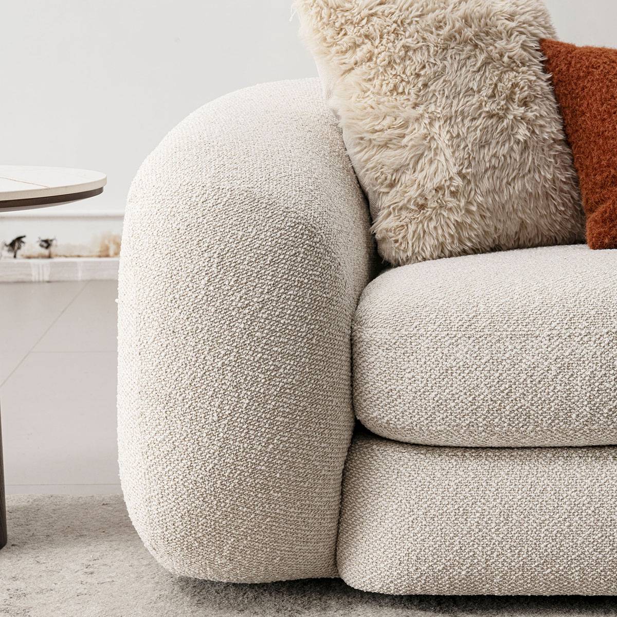 Close-up of the sofa armrest and boucle fabric texture