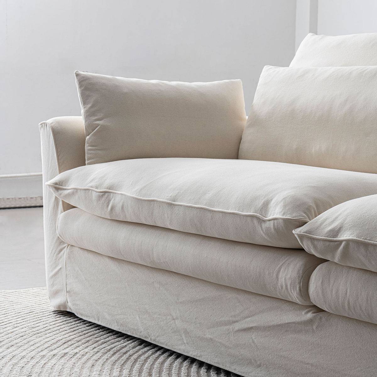 Side view of the sofa showing seat depth and armrest
