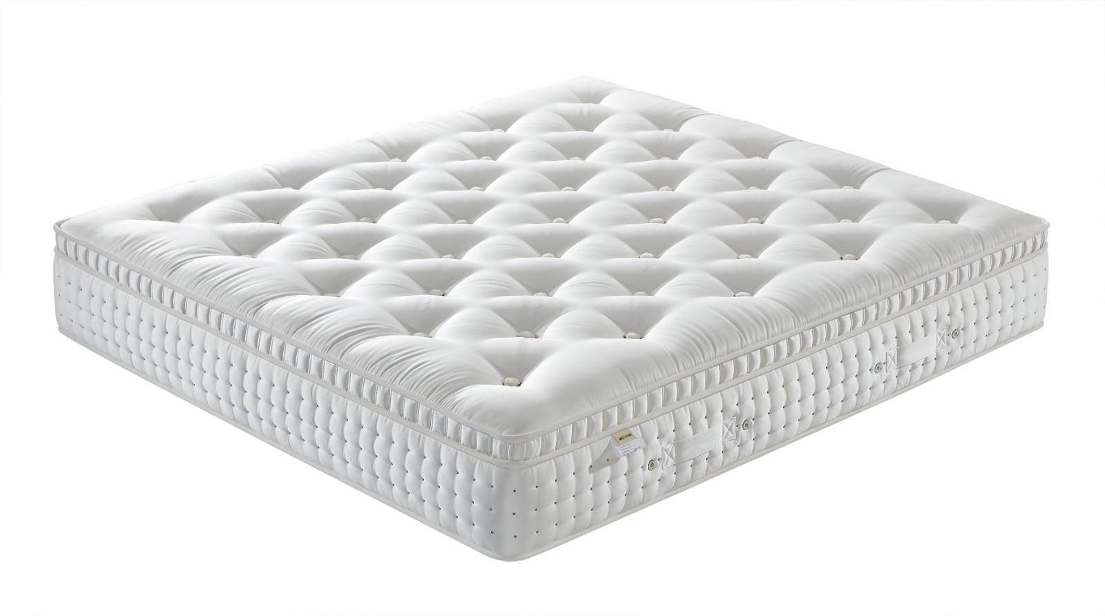 Close-up view of the mattress surface texture and side piping
