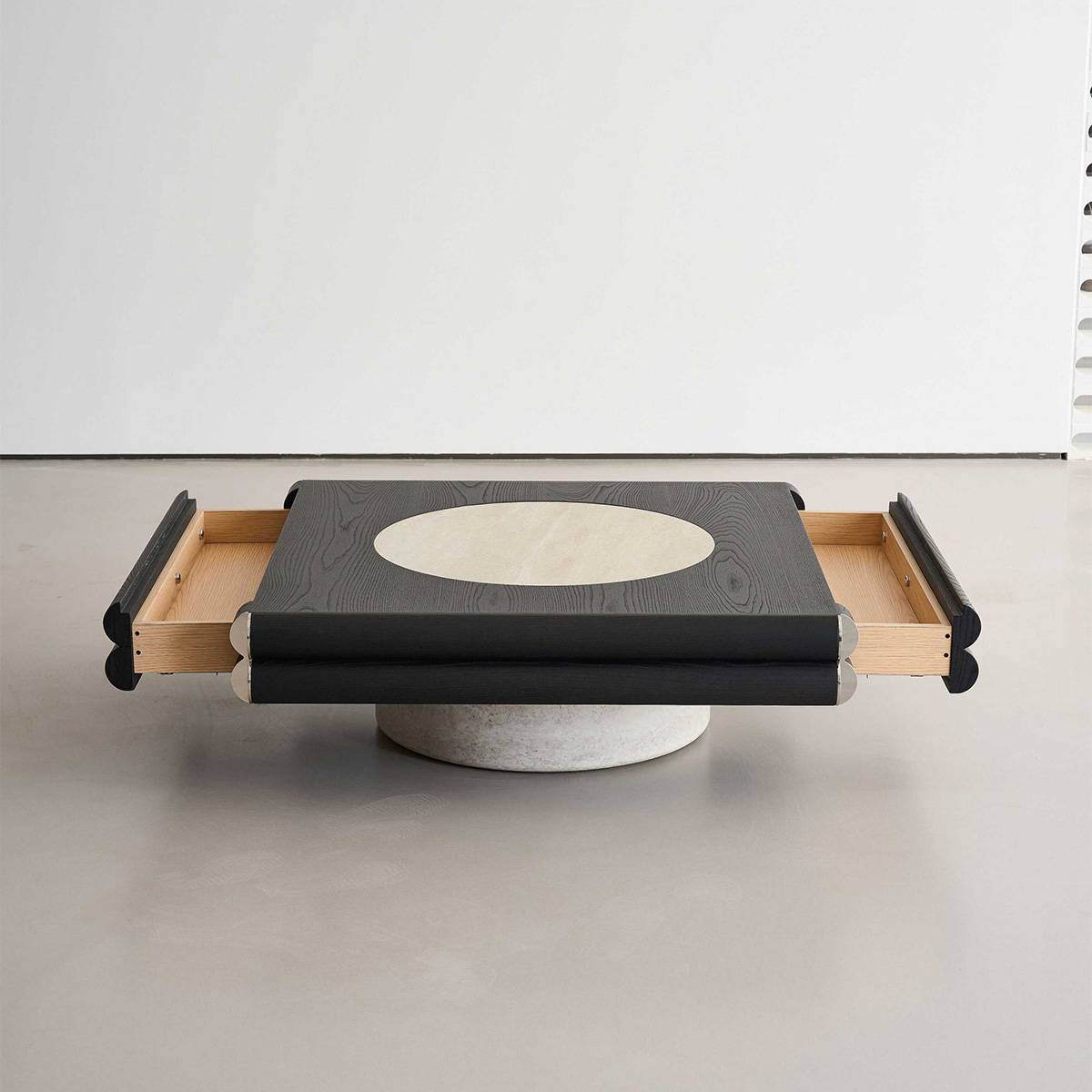 Front view of the coffee table with side drawers extended, revealing the stone base and light wood interior