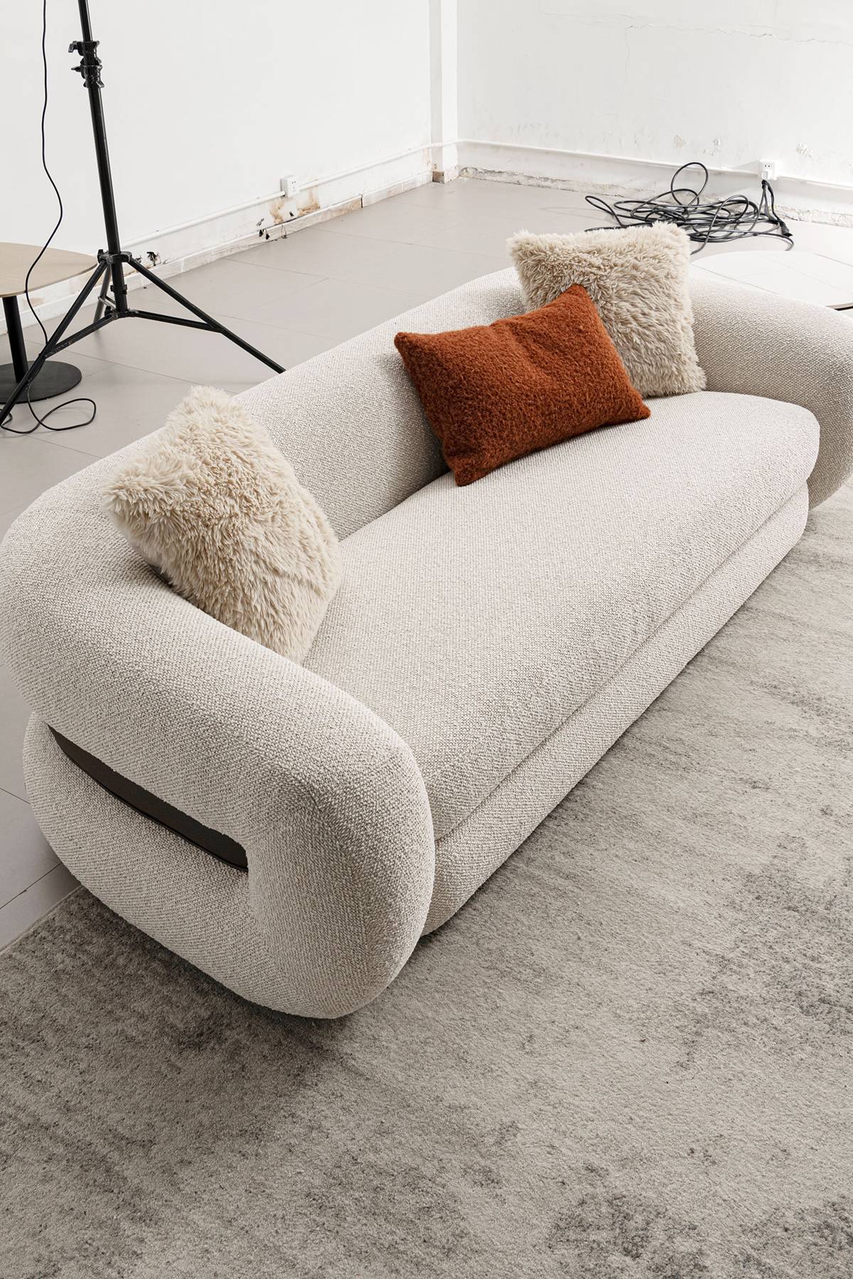 High-angle view of the entire sofa showing its shape and pillows