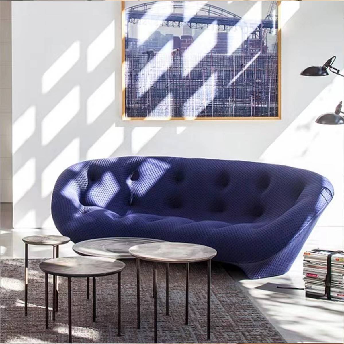 Blue shell sofa in a modern interior with sunlight shadows