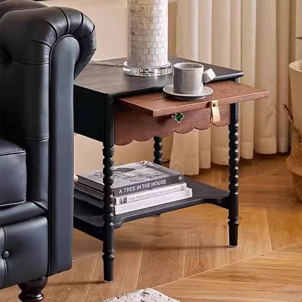 Mid-century bedside table next to a bed with pull-out tray extended holding a teacup