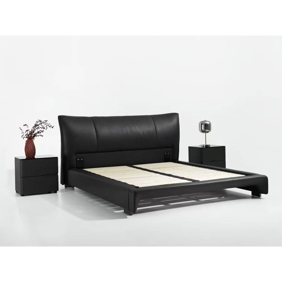 View of the bed frame without mattress, showing the wooden slat base and metal legs.