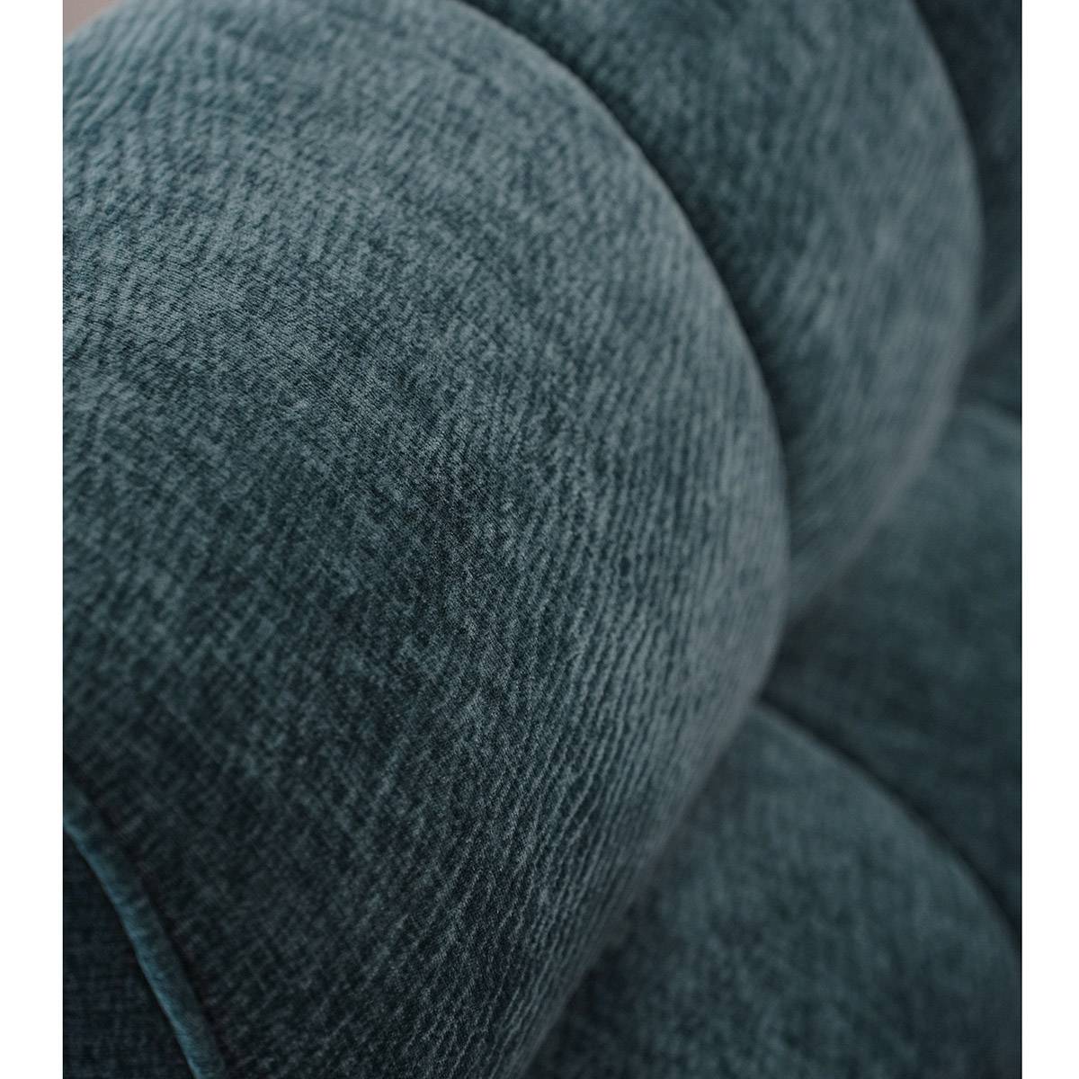 Close-up detail of the teal Sakura velvet fabric texture on the lounge chair