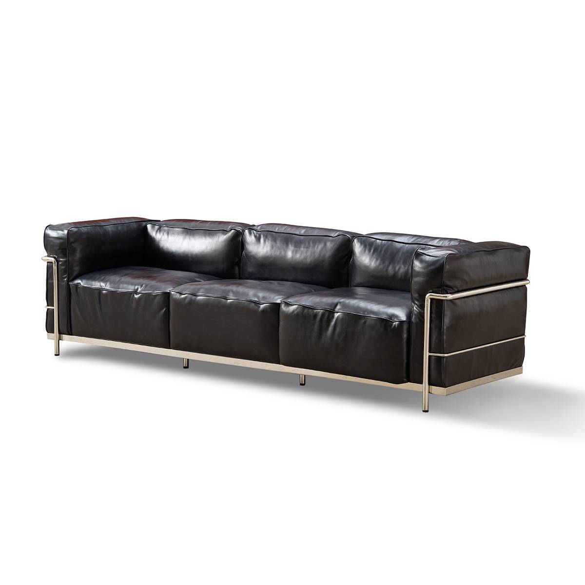Side profile view of the black leather sofa showing metal legs