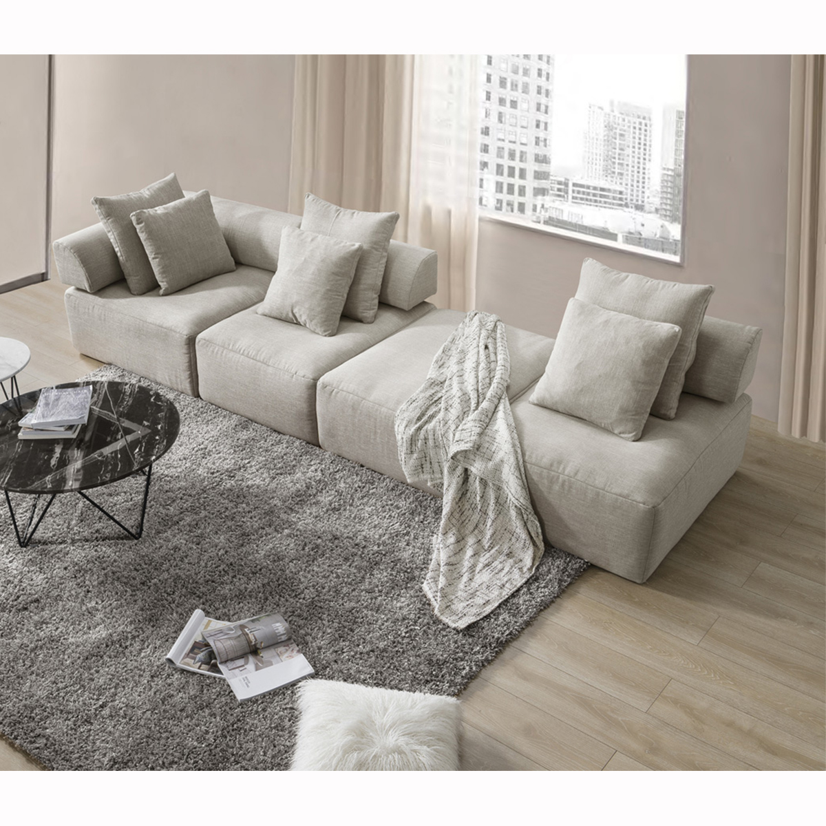 High-angle view of the modular sofa and ottoman arrangement in a living room setting.