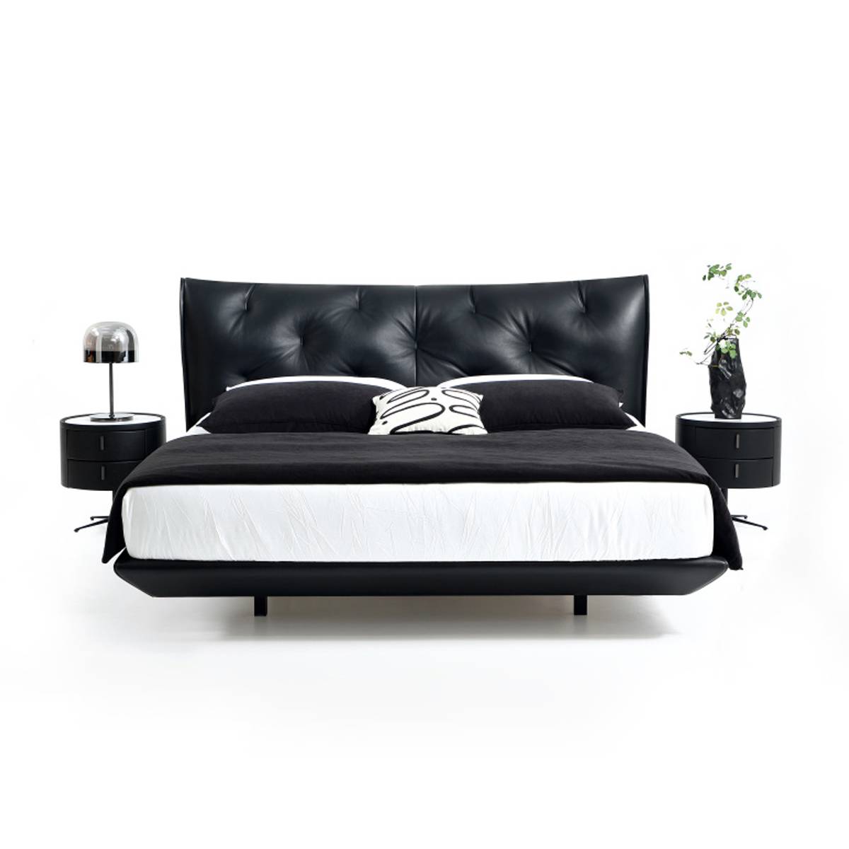 Front view of black leather bed showing tufted headboard details