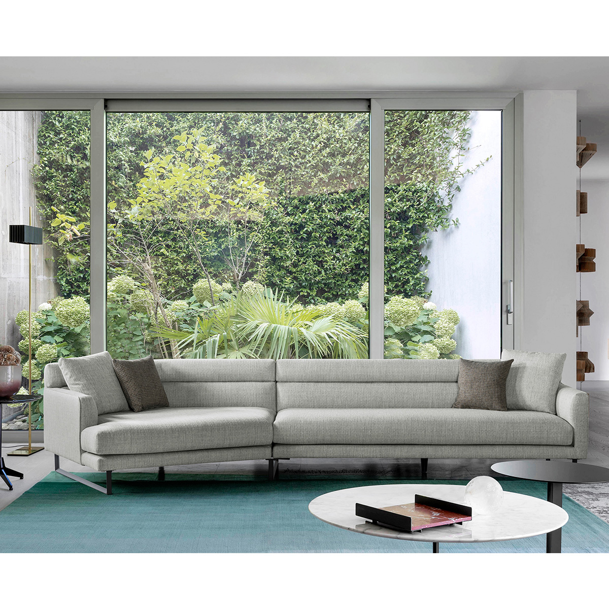 Lifestyle image of the sofa in a modern living room with a garden view