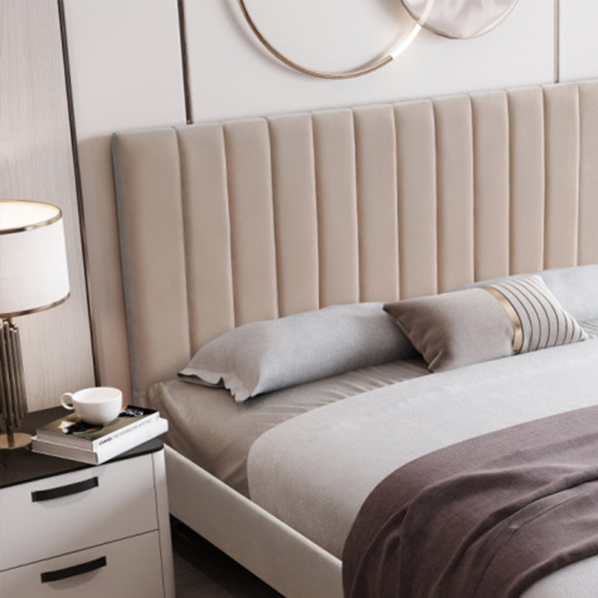 Close-up view of the bed headboard and pillows, highlighting the velvet texture.