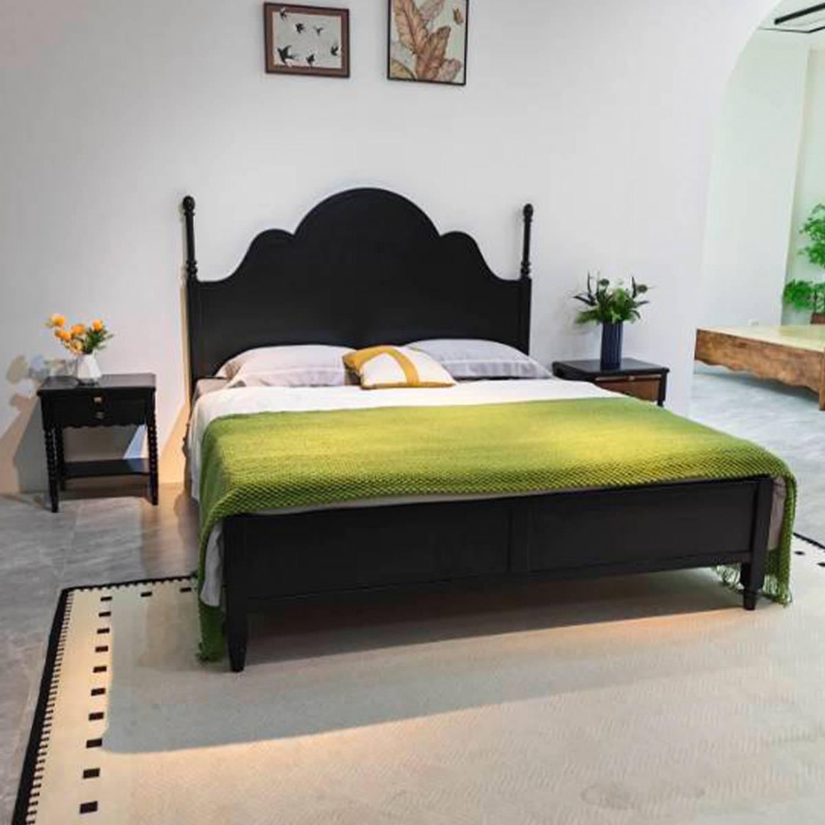 Front view of black finish bed with bedside tables
