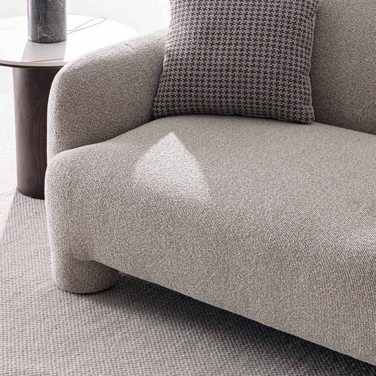 Close-up detail of the sofa seat cushion and leg