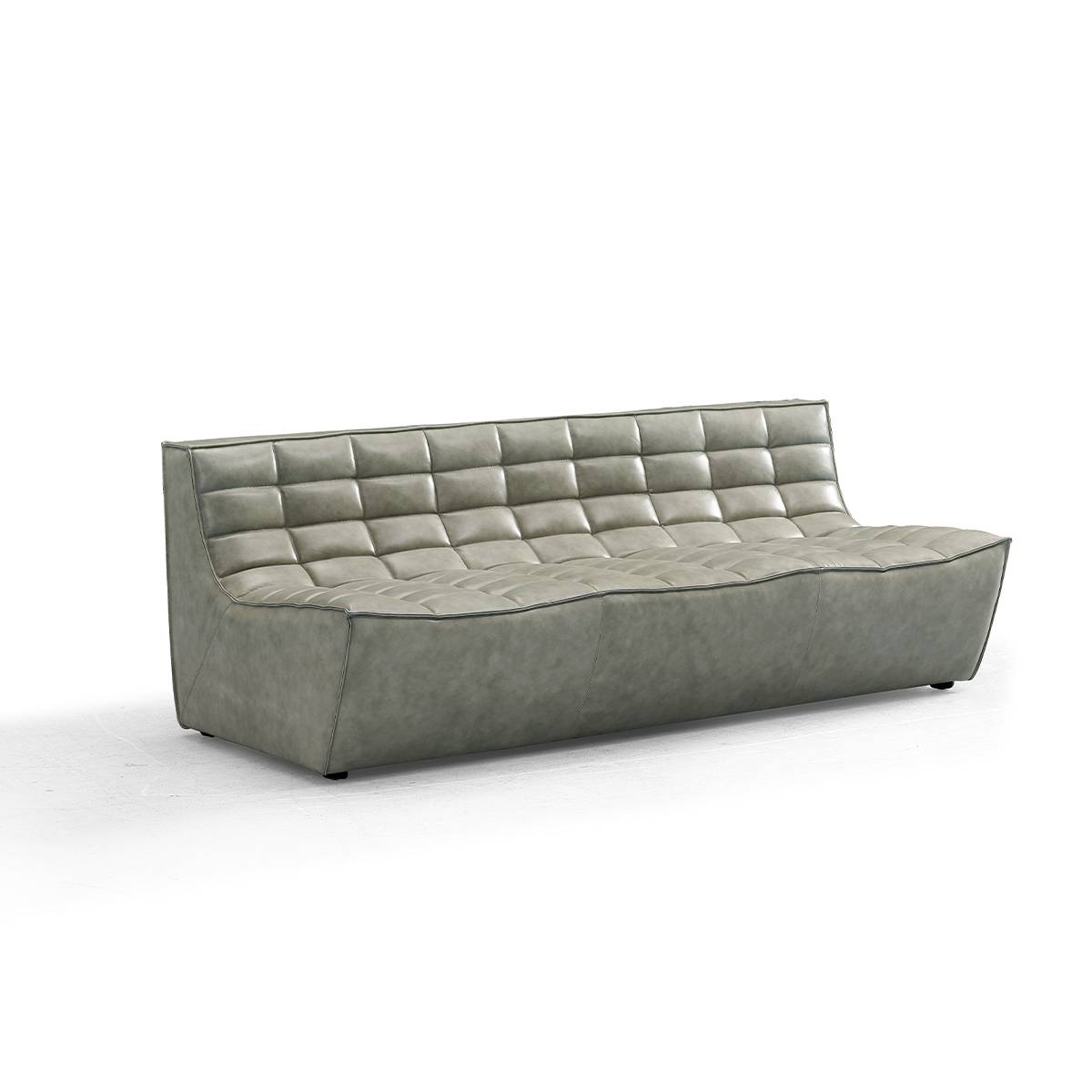Side angle view of grey tufted leather sofa