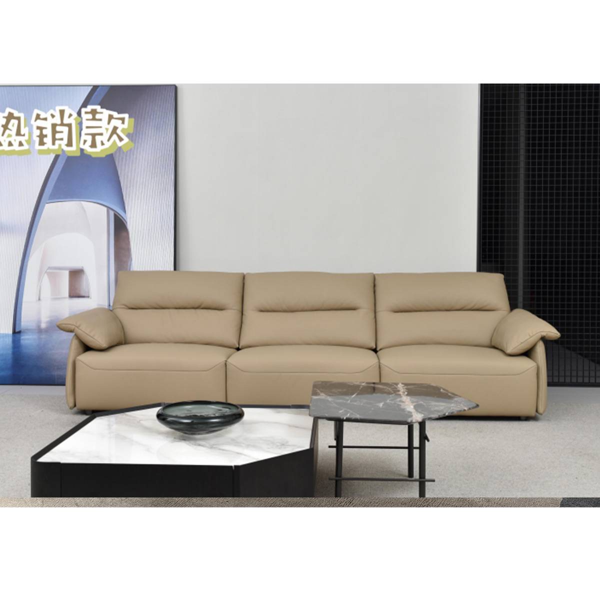 Lifestyle shot of the beige sofa in a modern living room setting with coffee tables