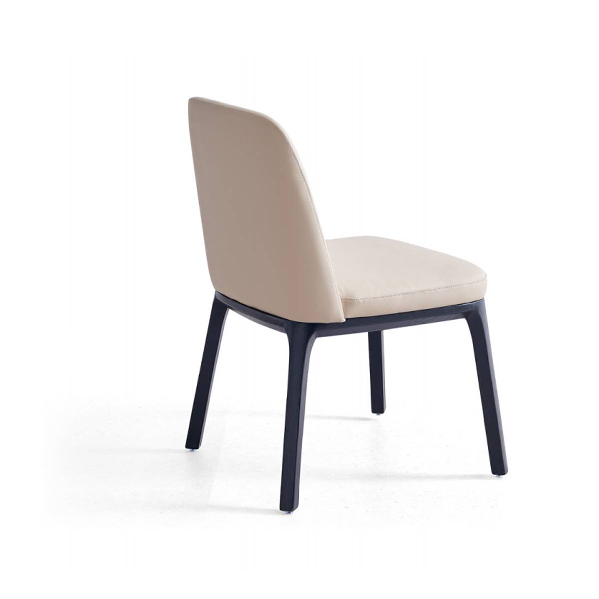 Side view of a beige upholstered dining chair with dark solid wood legs