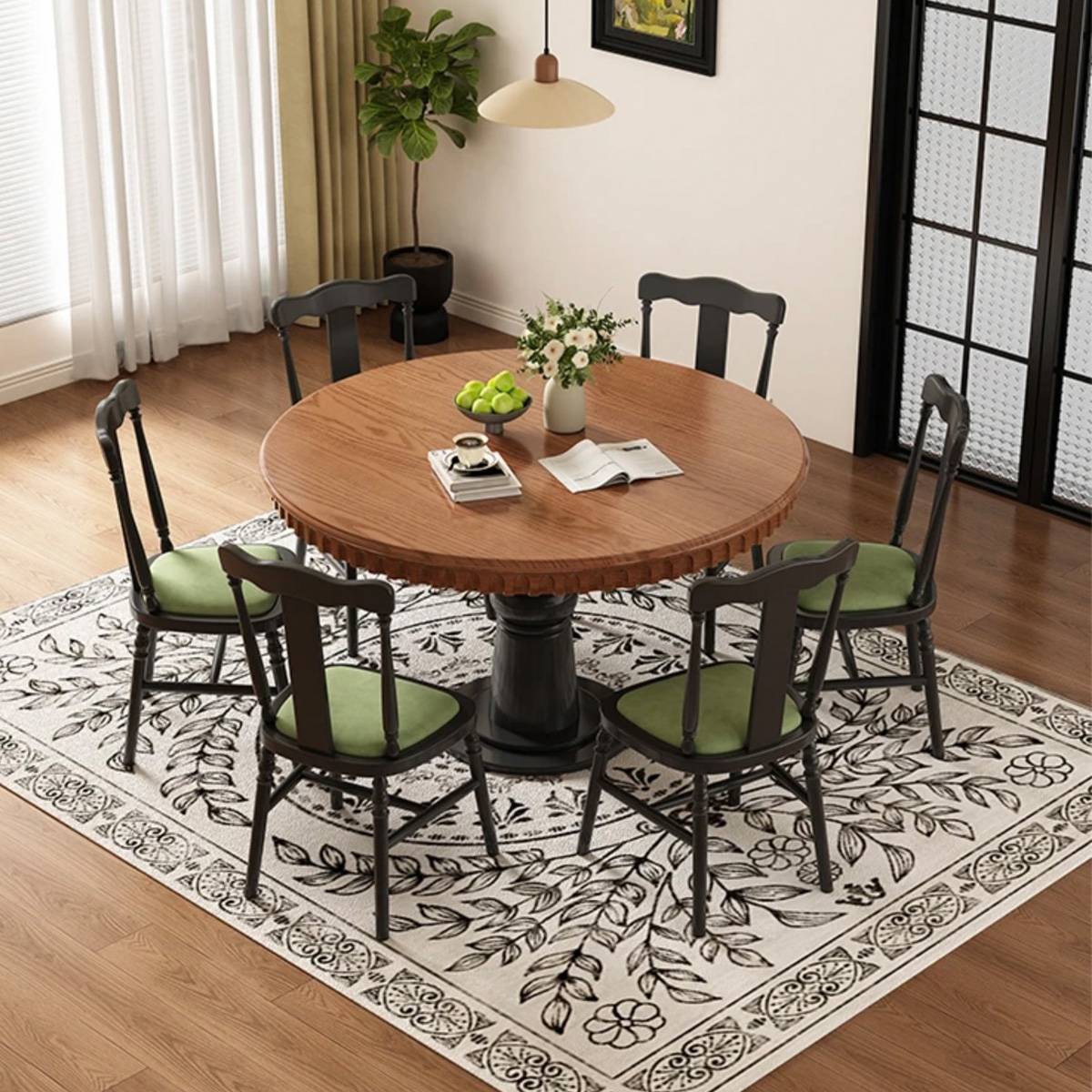 Set of dining chairs arranged around a round wooden table
