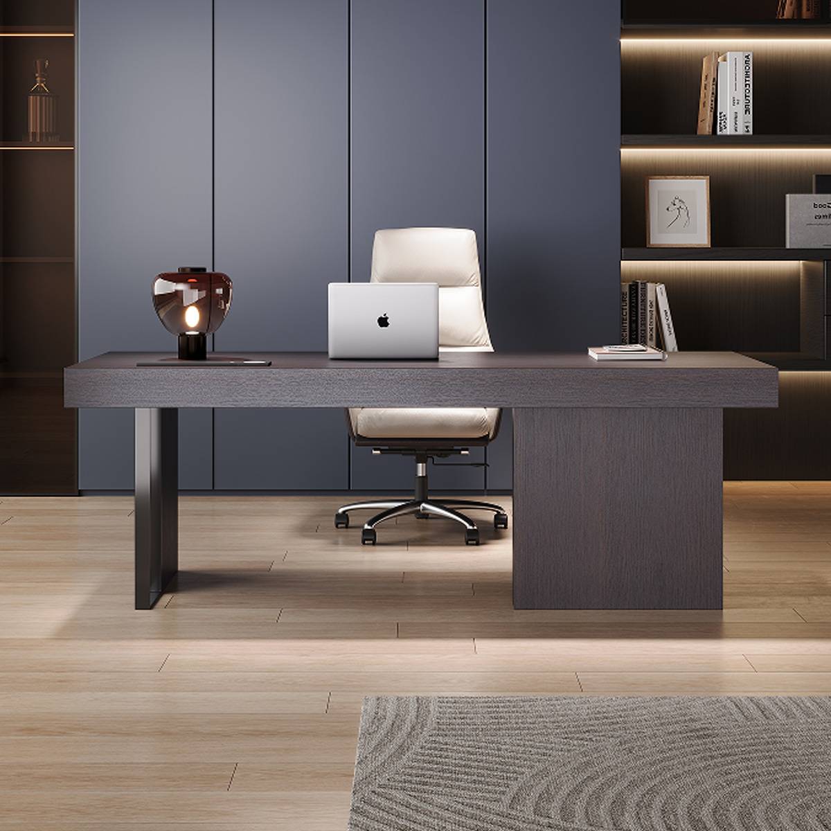Front view of the desk showing the carbon steel legs and office chair