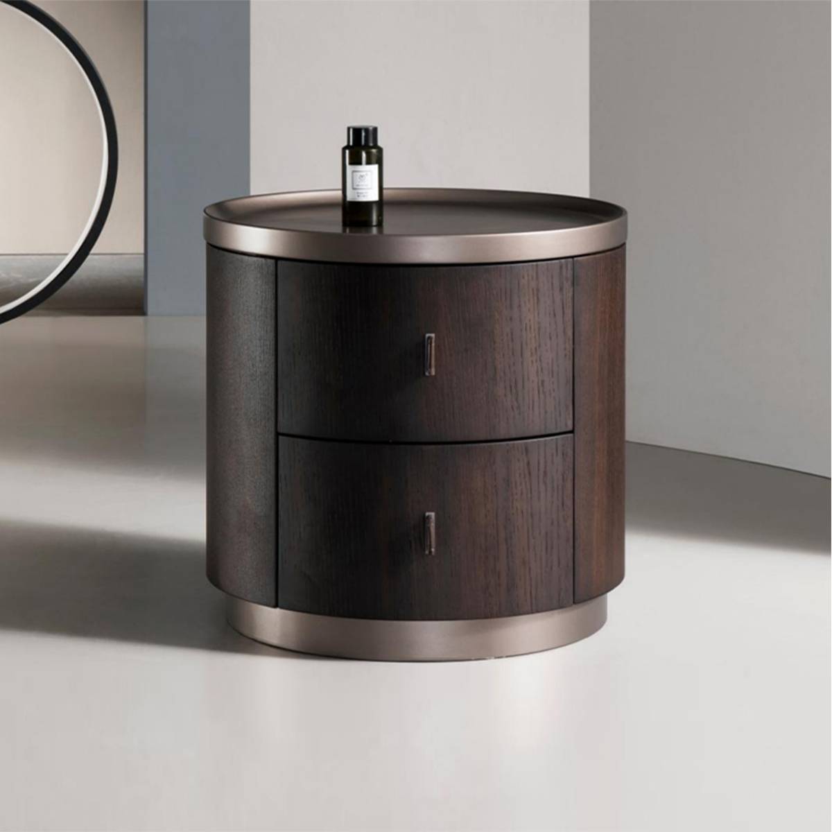 Side view of the round bedside cabinet in a bedroom setting