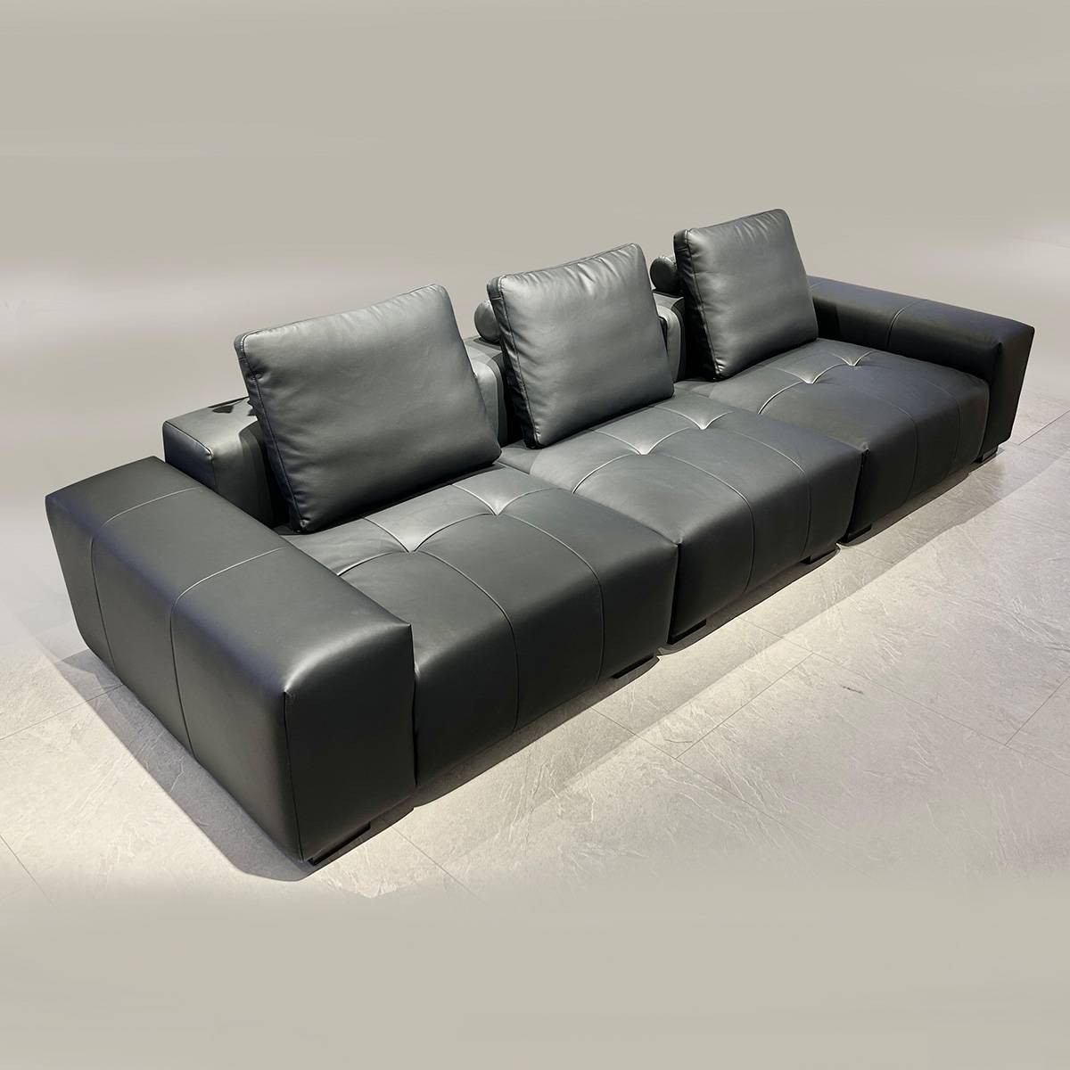 Full view of the black Pixel Straight Sofa in a showroom setting