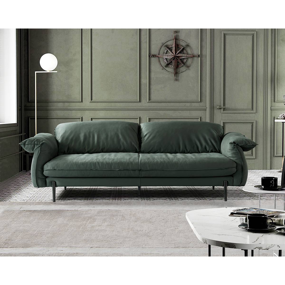 Close-up detail of the green suede fabric and stitching on the sofa armrest
