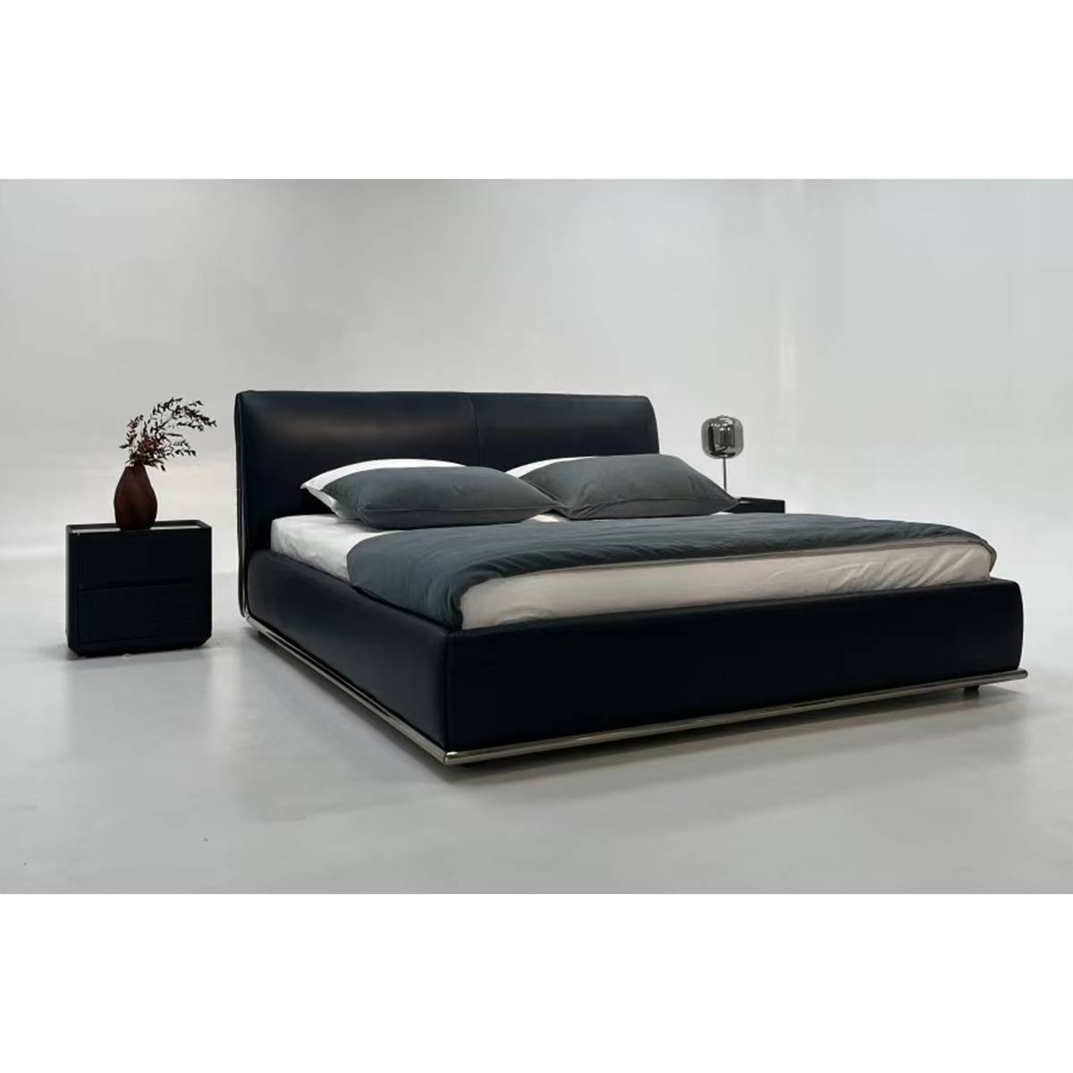 Three-quarter view of the bed with bedside tables