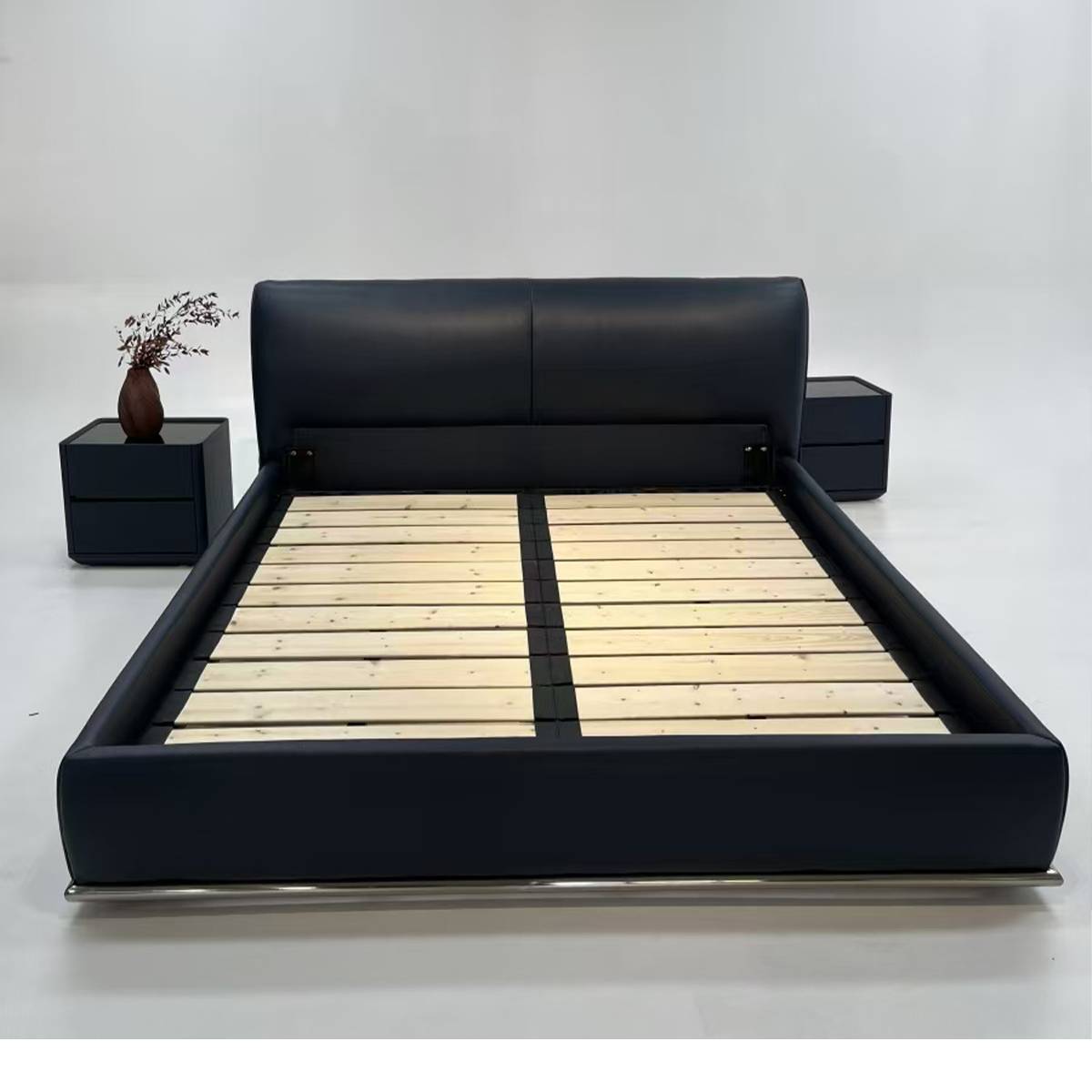 Bed frame without mattress showing wooden slat support system