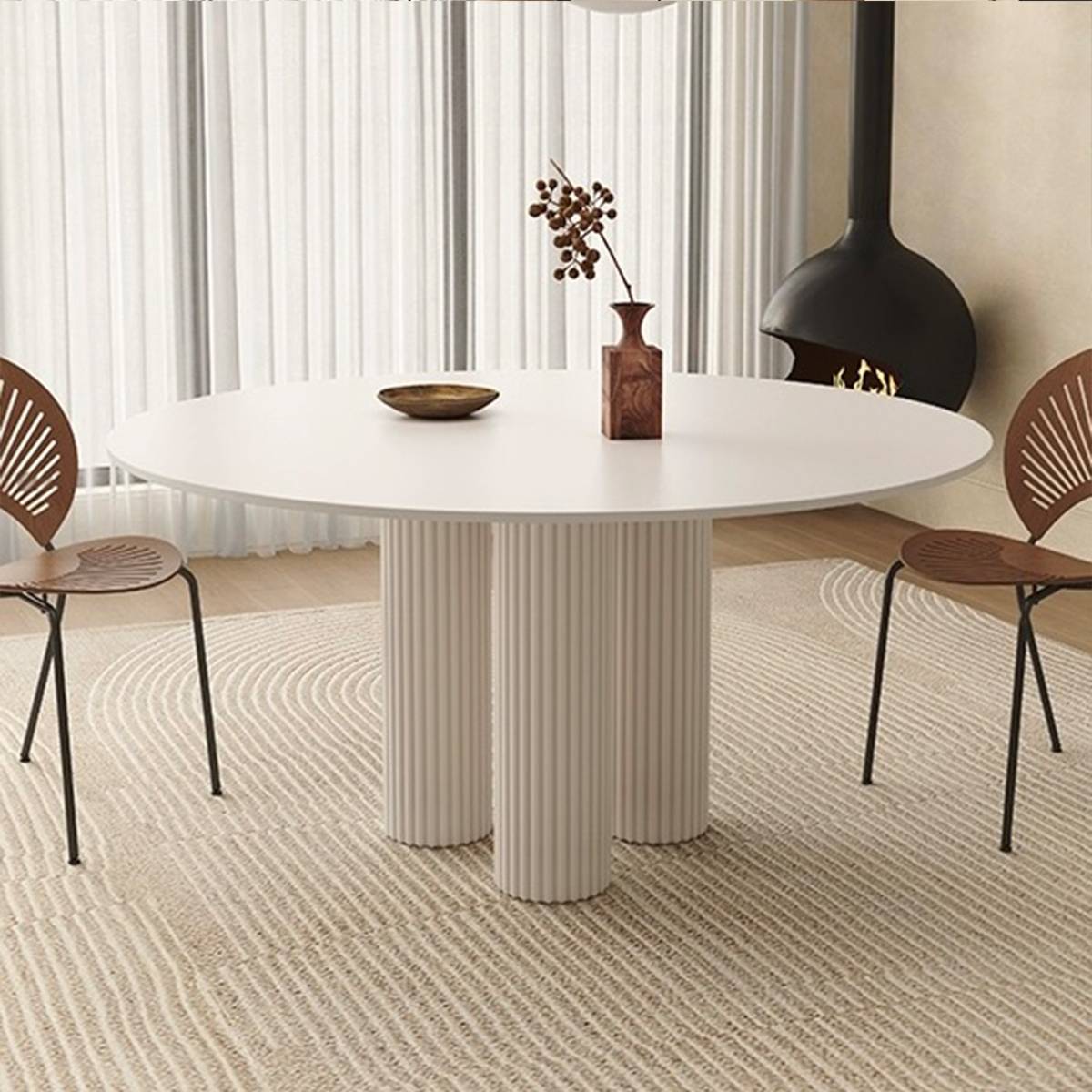 Close-up view of the dining table showing the fluted base and sintered stone top.