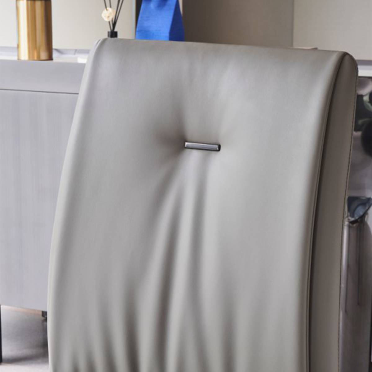 Close-up of the chair backrest showing the metal accent detail
