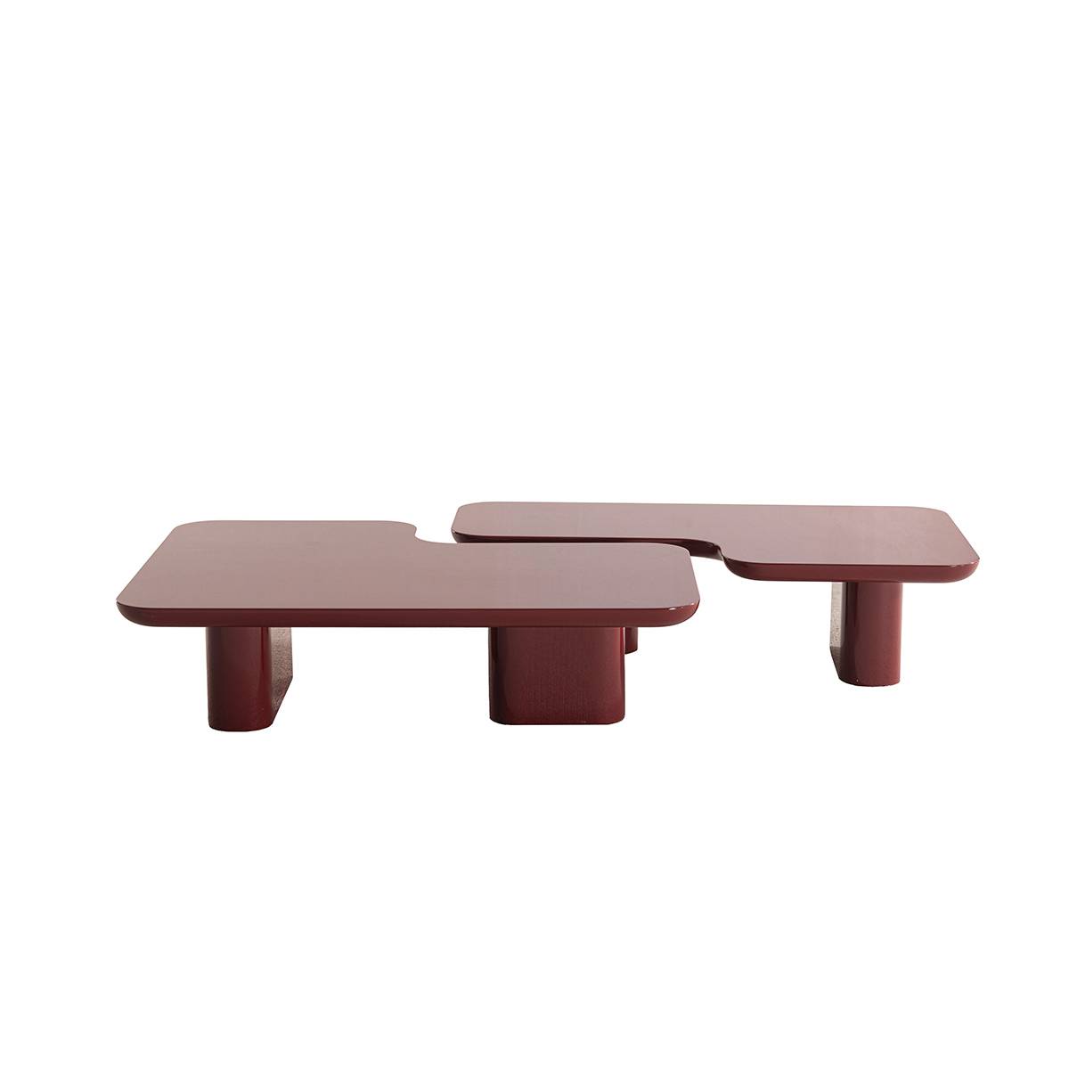 Side view of the burgundy irregular coffee table highlighting the profile and leg structure
